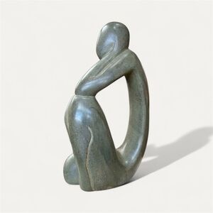 Gray Abstract Stone Sculpture with Fluid Curves